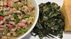 blacke eye peas plated corn bread and greens close up